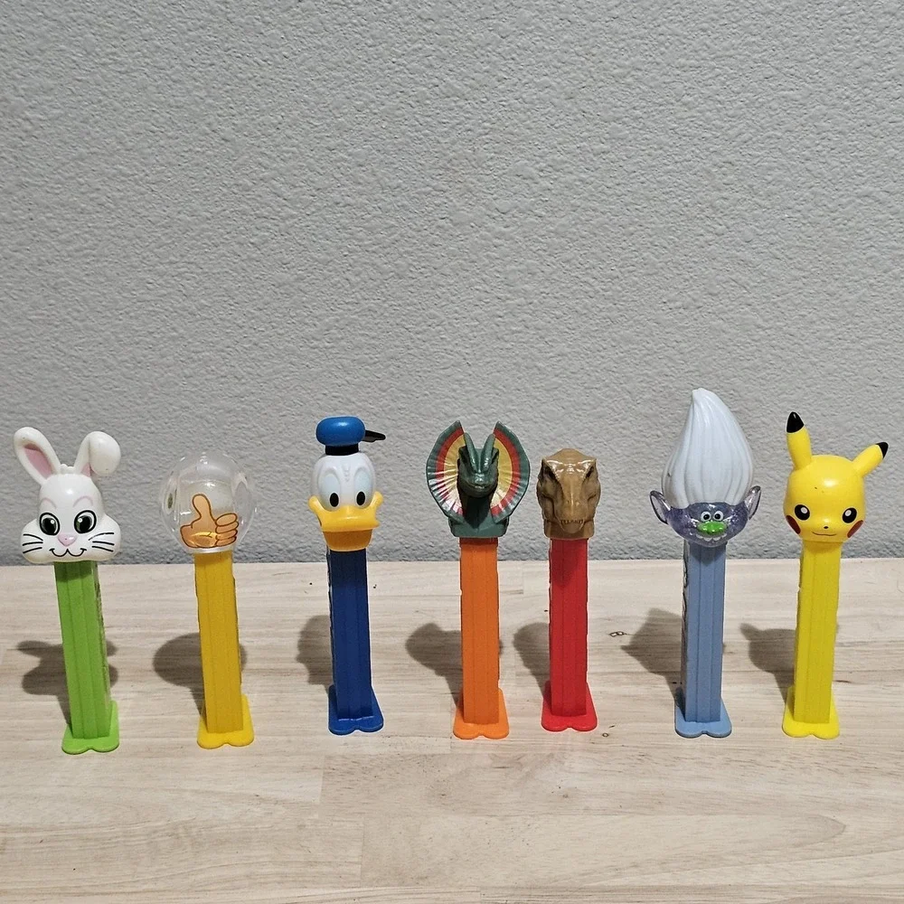 Vintage Pez Dispensers Lot of 7 Jurrasic Park, Daffy, Trolls, Emoji, Easter